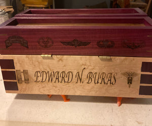 A beautiful custom handmade fly fishing tackle and fly tying station box. Made from stunning purple heart wood, bird's eye maple and black walnut. The box has been laser engraved to make it even more personalized.