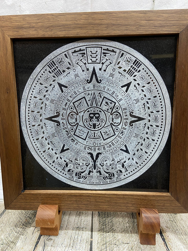 Aztec Calander laser engraved onto a piece of black granite. Then framed with a handcrafted black walnut frame with walnut splines.