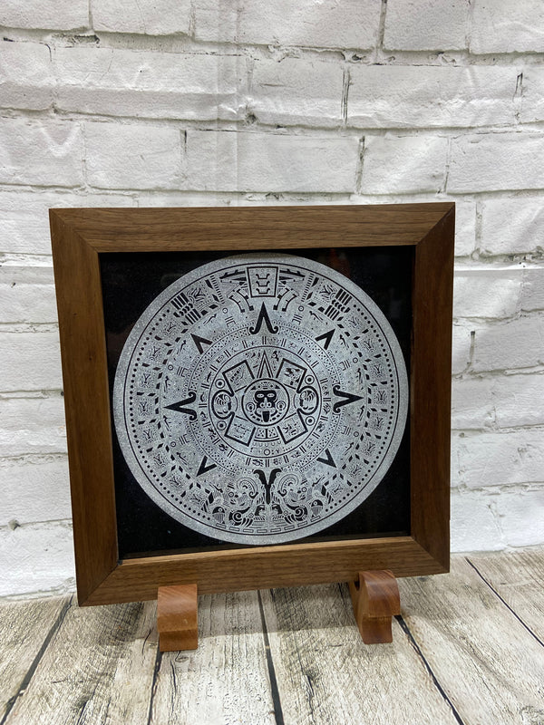 Aztec Calander laser engraved onto a piece of black granite. Then framed with a handcrafted black walnut frame with walnut splines.