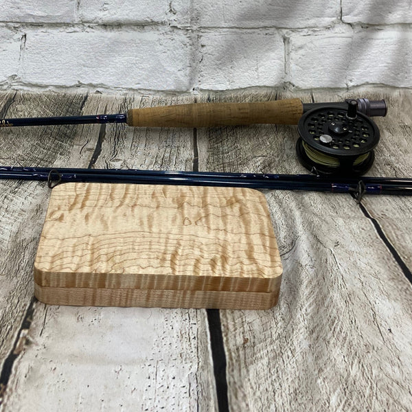 This fly box is made with highly figured curly maple wood. Hinged with a barrel hinges, and earth magnets to hold close to give it a sleek look. Fly box can hold up to 80 flies depending on types of flies.. This fly box will show everyone on the water, you love fly fishing and do it in style! This fly box measurements are 4 5/8 inch wide x 6 7/8 inch length x 1 1/8 deep. All fly boxes are finished with Total Boat Halcyon clear varnish.