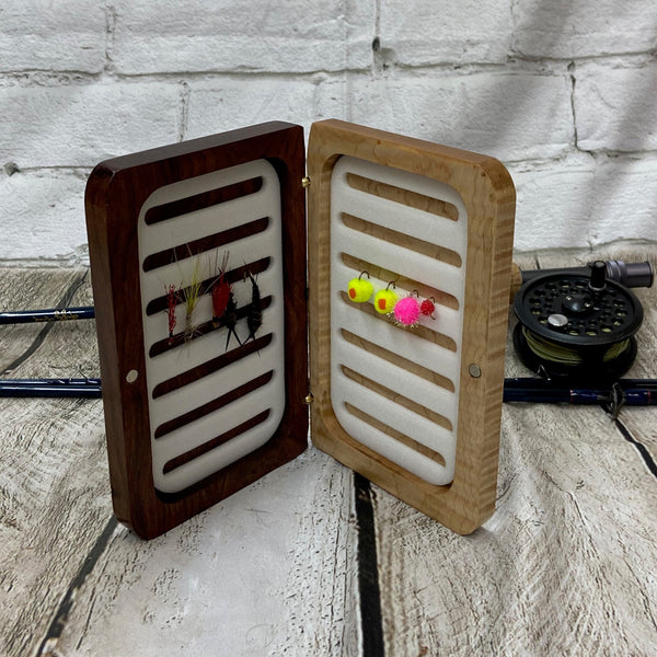 A curly maple and chechen wooden fly box able to hold 80 flies. Finished with Total Boat halcyon to a very nice polish finish.