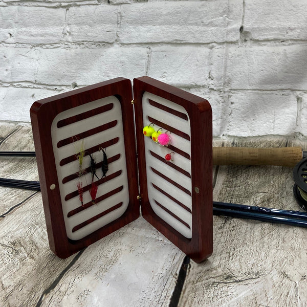 A lovely pad-auk fly box, with white fly foam inserts. Barrel hinges and earth magnets to hold the two half's securely closed.