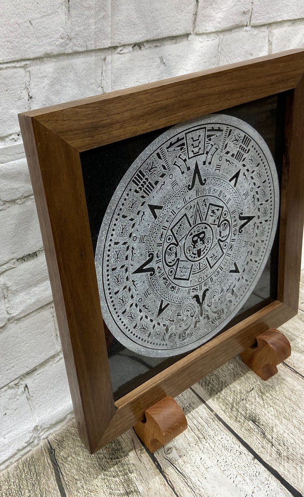 Aztec Calander laser engraved onto a piece of black granite. Then framed with a handcrafted black walnut frame with walnut splines.