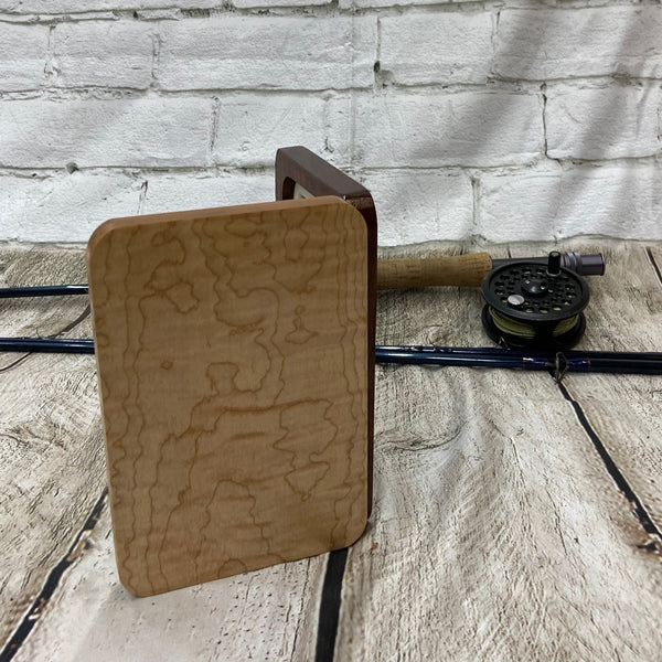 A curly maple and chechen wooden fly box able to hold 80 flies. Finished with Total Boat halcyon to a very nice polish finish.
