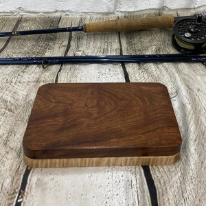 A curly maple and chechen wooden fly box able to hold 80 flies. Finished with Total Boat halcyon to a very nice polish finish.