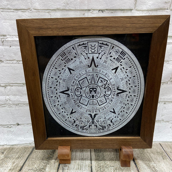 Aztec Calander laser engraved onto a piece of black granite. Then framed with a handcrafted black walnut frame with walnut splines.