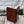 Load image into Gallery viewer, This fly box is made with a beautiful wood called pad-auk. Hinged with a barrel hinges, and earth magnets to hold close to give it a sleek look. Fly box can hold up to 80 flies depending on types of flies. This fly box will show everyone on the water, you love fly fishing and do it in style! This fly box measurements are 4 5/8 inch wide x 6 7/8 inch length x 1 1/8 deep. All fly boxes are finished in Total Boat halcyon clear varnish.