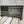 Load image into Gallery viewer, A scene of New York city skyline and the Statue of Liberty on the US flag. All laser engraved onto a piece of black slate.