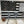 Load image into Gallery viewer, This is a closer look at the left side of the flag. At the bottom left you have the 75th Ranger Regimental crest, Then to the right of the crest you have the Ranger tab, 1st Ranger Battalion Tab and 75th crest all stacked with the crest being on the bottom.