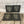 Load image into Gallery viewer, Four slate coasters laser engraved with a RN shield logo.