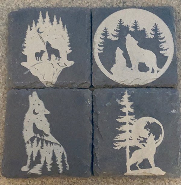 4 laser engraved slate coasters with wolf  scenes