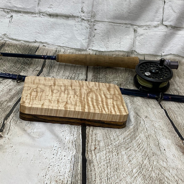 Bobcote and curly maple fly box. Has a fly rod for display prepose only. Product you get is only the fly box