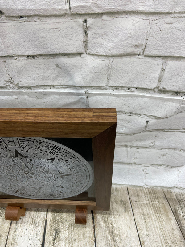 Aztec Calander laser engraved onto a piece of black granite. Then framed with a handcrafted black walnut frame with walnut splines. This gives you a closer look at the double splines.