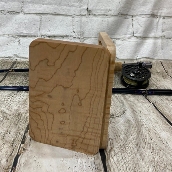 This fly box is made with highly figured curly maple wood. Hinged with a barrel hinges, and earth magnets to hold close to give it a sleek look. Fly box can hold up to 80 flies depending on types of flies.. This fly box will show everyone on the water, you love fly fishing and do it in style! This fly box measurements are 4 5/8 inch wide x 6 7/8 inch length x 1 1/8 deep. All fly boxes are finished with Total Boat Halcyon clear varnish.