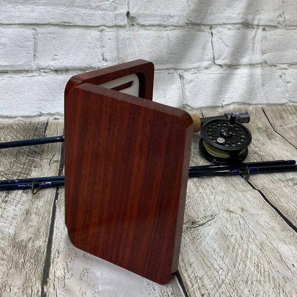 This fly box is made with a beautiful wood called pad-auk. Hinged with a barrel hinges, and earth magnets to hold close to give it a sleek look. Fly box can hold up to 80 flies depending on types of flies. This fly box will show everyone on the water, you love fly fishing and do it in style! This fly box measurements are 4 5/8 inch wide x 6 7/8 inch length x 1 1/8 deep. All fly boxes are finished in Total Boat halcyon clear varnish.