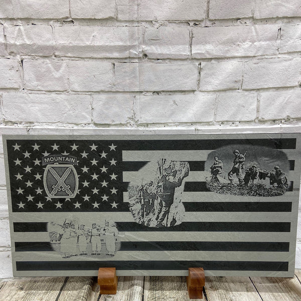 The 10th Mountain Division was key in winning World War 2. Here we have laser engraved the US flag with the 10th Mountain Patch and three scenes from World War 2 on a piece of black slate. The slate sits on two handcraft mahogany wood stands.