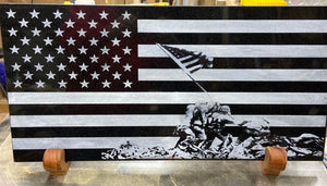The American with the scene of the US Marines raising the flag on Imo Jima on it. All laser engraved into black granite and then color filled with white, to make the engraving pop.