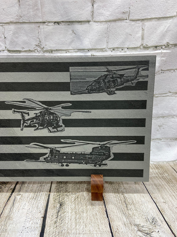 A close up of the right side of the flag with UH-60 Special Ops Helicopter, CH-47 Cheenook Special Ops Helicopter and the Special Ops Little Bird on the US flag. All the is laser engraved on 24 inch by 12 inch piece of slate.