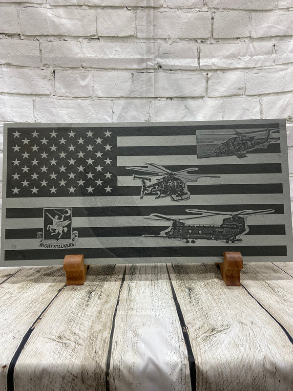 The 160th Special Operations Aviation Regiment also known as the Knight Stalkers. We made this flag for those hard charging warriors who fly our Special Operational Forces into danger. This flag has the 160th SOAR crest, UH-60 Special Ops Helicopter, CH-47 Cheenook Special Ops Helicopter and the Special Ops Little Bird on the US flag. All the is laser engraved on 24 inch by 12 inch piece of slate.